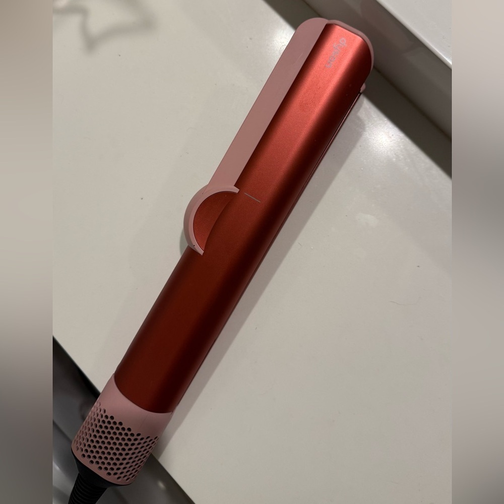 Dyson Airstrait in strawberry bronze